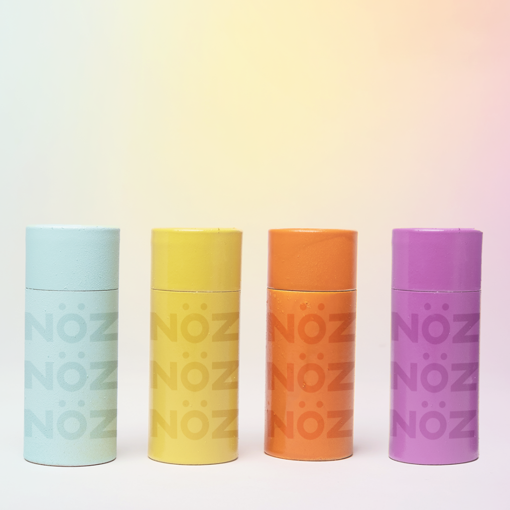 4 colorful noz reef safe sunscreen lotion bottles