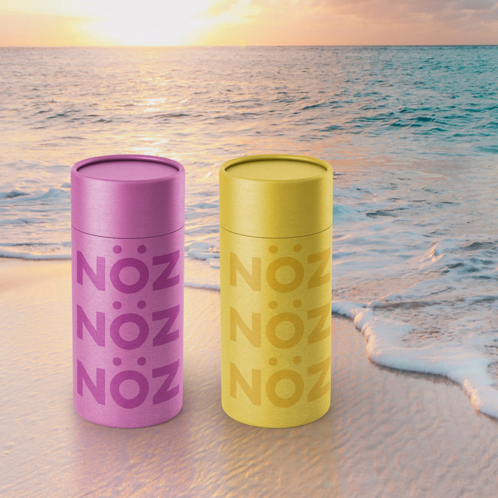 2 noz reef safe sunscreen lotions chilling at the beach